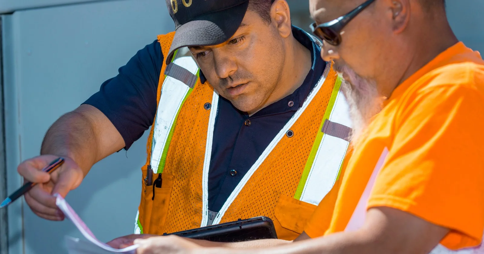 Oregon commercial vehicle personnel reviewing paperwork in a July 2019 photograph